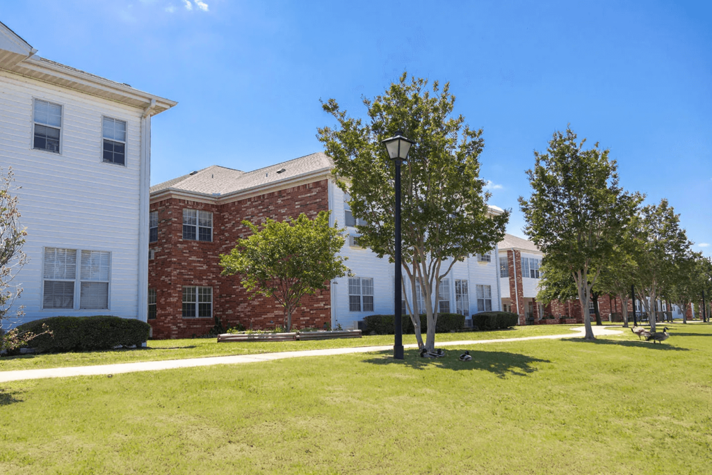 Frontside of Wichita Falls Assisted Living Facility With Ducks Roaming on the Grass