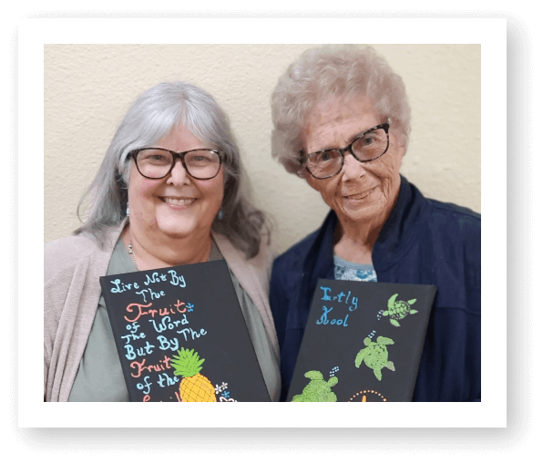 Elderly Women Showing Their Paintings in Assisted Living Facility Wichita Falls TX
