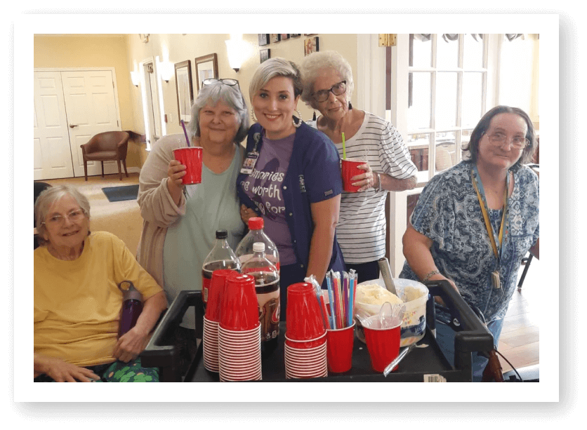 Seniors Enjoying Soda and Ice Cream in Wichita Falls Assisted Living Facility