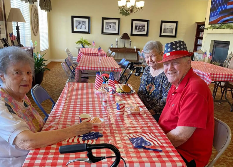 Seniors Eating Lunch and Celebrating America Day in Assisted Living Facility Wichita Falls TX Seniors Eating Lunch and Celebrating America Day in Assisted Living Facility Wichita Falls TX